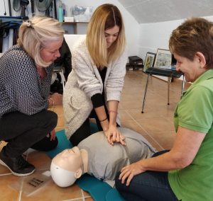 Bodyworks Team practising CPR on their First Aid Course